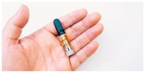 hand holding a distillate cartridge