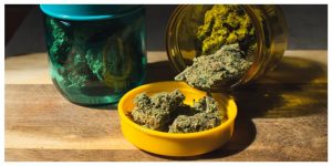 Closeup shot of medicinal recreational marihuana buds in colorful jars
