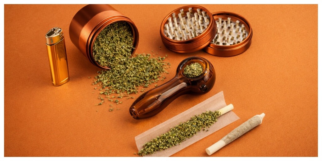 best smoking accessories setup on table, orange cannabis accessories on orange surface