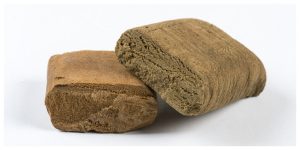 what is ice hash, bubble hash or ice o lator hash explained, two bricks of hash on white background