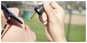 cbg for adhd, woman taking cbd oil or cbg oil for anxiety and adhd